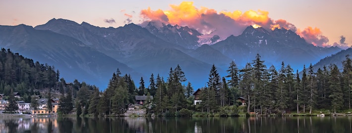 Mountain lodge with sunset